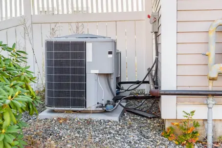 outdoor AC unit by fence